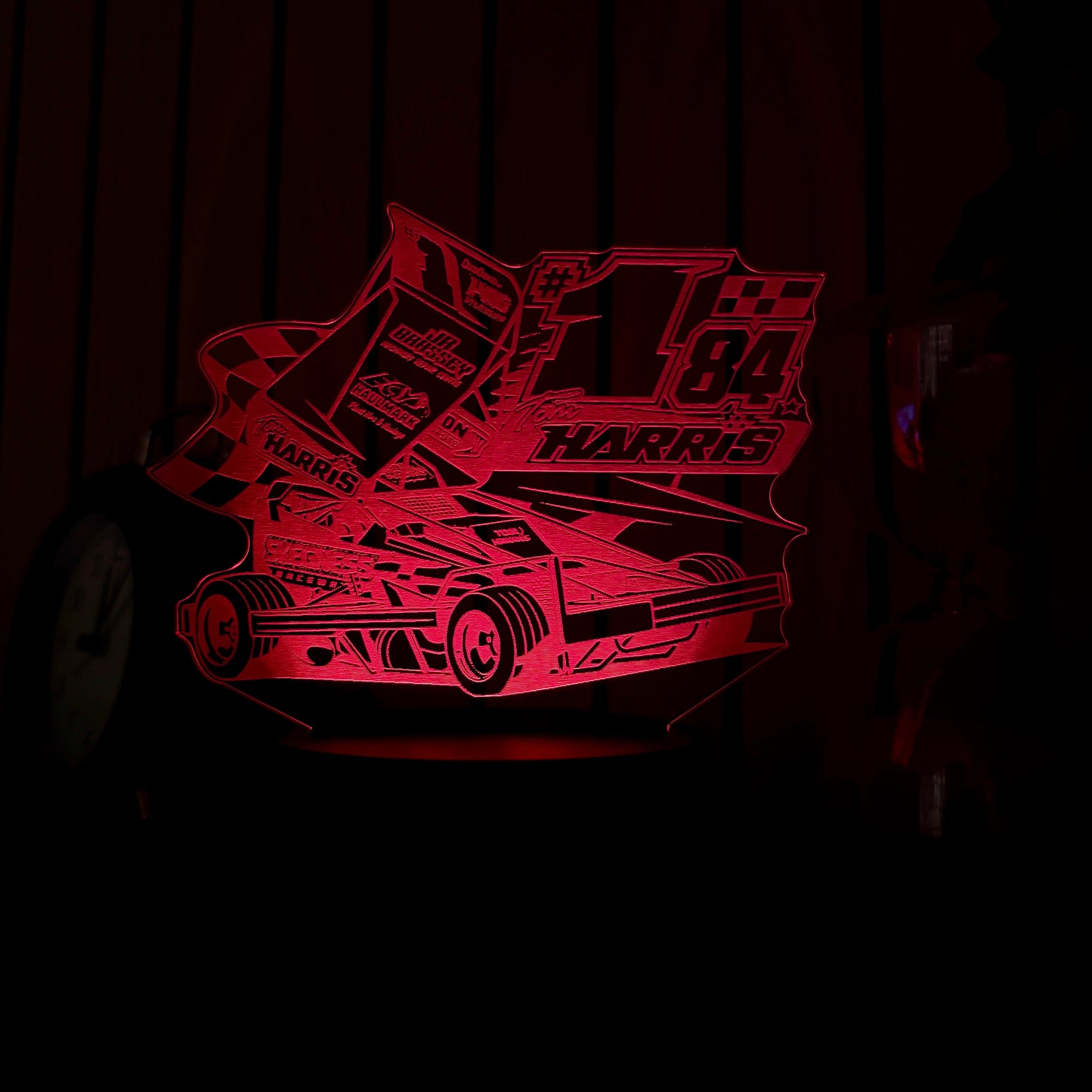 Red race car graphic with 'Harris' branding on a dark background