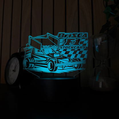 Brisca F1 Stockcars shale wing LED night light glowing blue on black base with chequered flag design